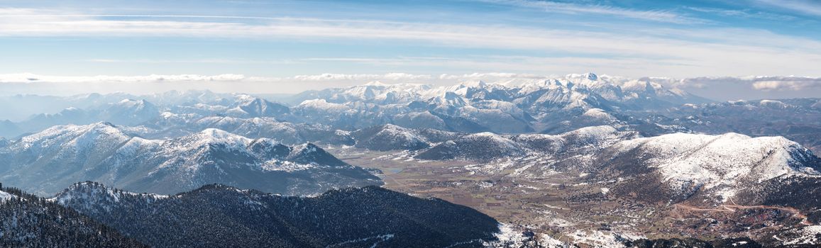 Panoramic landscape of mountains with snow in Kalavrita, Greece