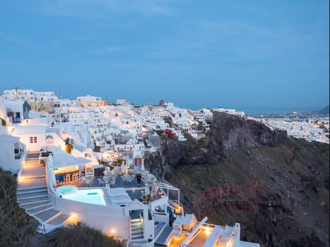 Small white houses with lights late in the afternoon in Santorini island in Cyclades,Greece