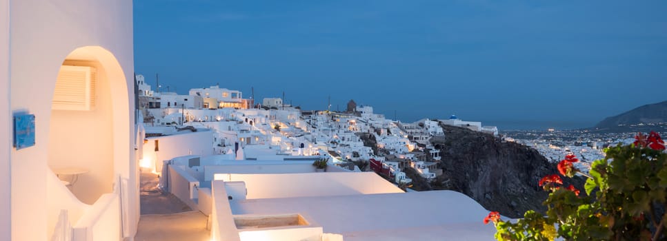Small white houses with lights late in the afternoon in Santorini island in Cyclades,Greece