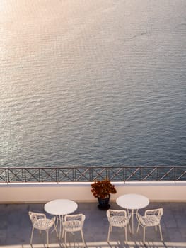 Balcony with tables and sea view in Santorini, Greece 