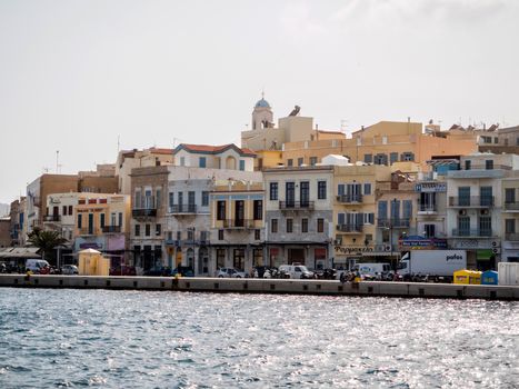 SYROS, GREECE - APRIL 9, 2016: View of Syros town with beautiful buildings and houses  in a sunny day before the tourist season for the summer