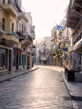 SYROS, GREECE - APRIL 9, 2016: View of Syros town street with beautiful buildings and shops