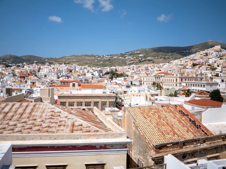 View of Syros town with beautiful buildings and houses in a sunny day