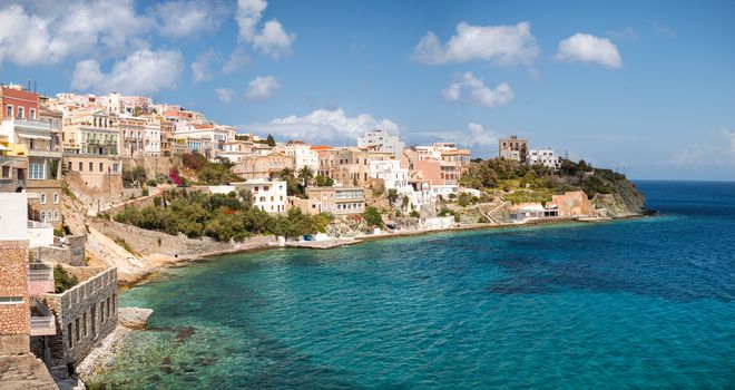 View of Syros town with beautiful buildings and houses  in a sunny day