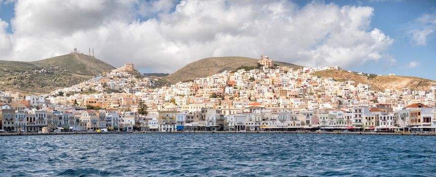 SYROS, GREECE - APRIL 10, 2016: Panoramic view of Syros town with beautiful buildings and houses in a sunny day