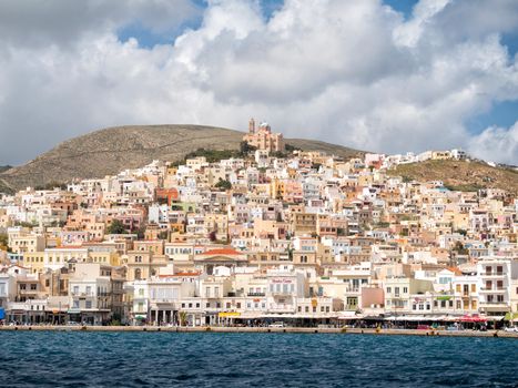 SYROS, GREECE - APRIL 10, 2016: View of Syros town with beautiful buildings and houses in a sunny day