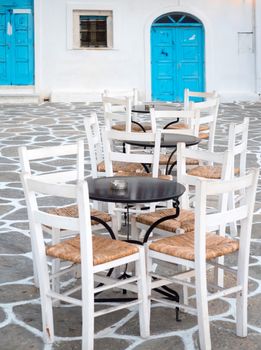 Close up of tables and chairs in town of Paros, Greece