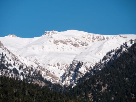 Landscape of Helmos mountain covered with snow in a sunny day,Kalavrita,Greece