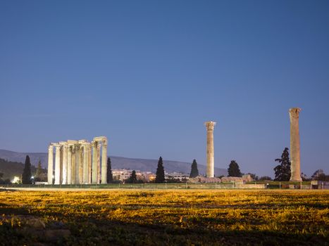 Temple of Olympian Zeus,illuminated at night with clear blue sky, Athens, Greece