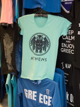 ATHENS,GREECE-JANUARY 2, 2017: Clothes with Athens logo outside a store in the historic center of Athens,Greece