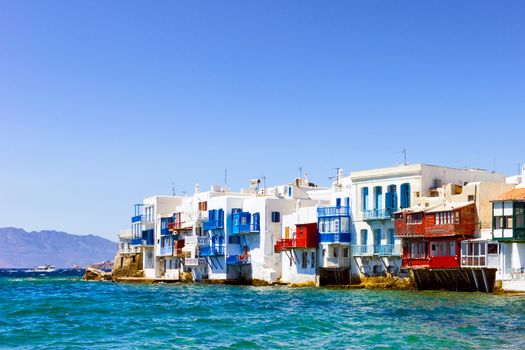 MYKONOS, GREECE - JUNE 23,2014: Colorful houses by the sea in Mykonos island