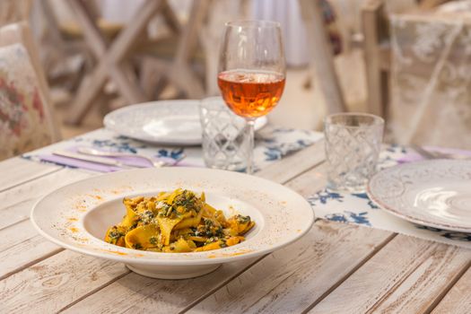 Gourmet fresh pasta with lentil served on a white plate