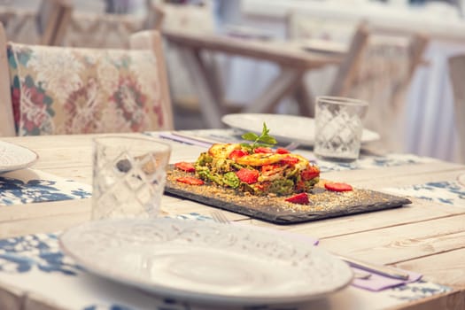 Gourmet vegetable pie beautiful decorated and served on a graphite plate