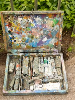 ATHENS, GREECE - JANUARY 2,2017: Box with used oil color tubes for painting in a street 