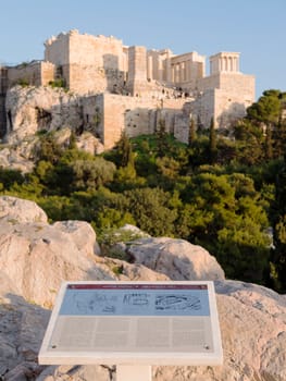 Informative sign of Areopagus and Acropolis hill in the background,Athens, Greece