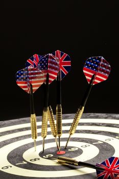 Indoor game Darts on a black studio background