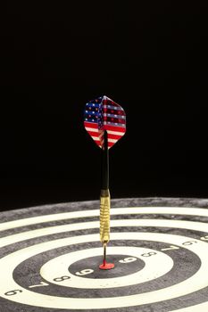 Indoor game Darts on a black studio background