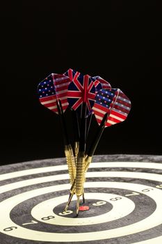 Indoor game Darts on a black studio background