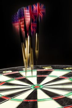 Indoor game Darts on a black studio background