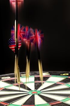 Indoor game Darts on a black studio background
