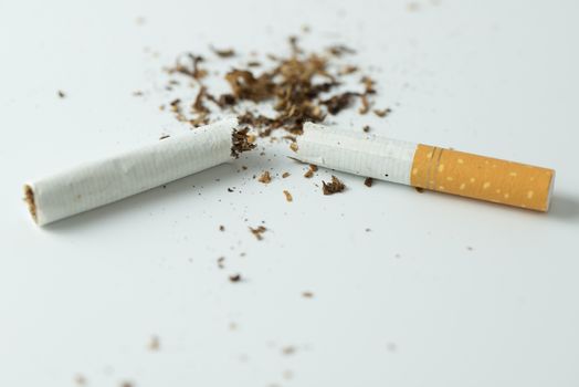 Stop smoking by breaking the cigarette or hand crushing cigarette quitting smoking concept