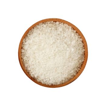 Close up one wooden bowl full of white marine rock salt isolated on white background, elevated top view, directly above