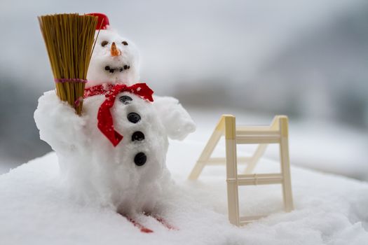 Snowman standing in winter landscape