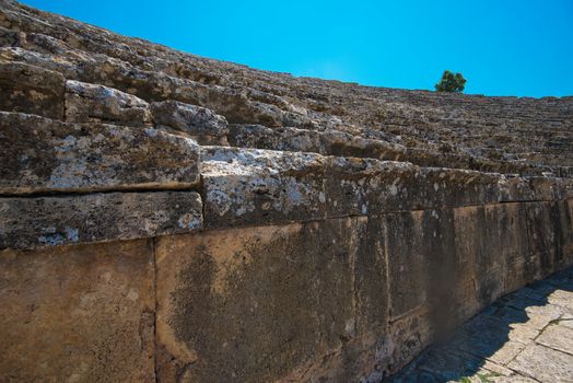 Roman amphitheatre in the ruins of Hierapolis, in Pamukkale, near modern turkey city Denizli, Turkey.