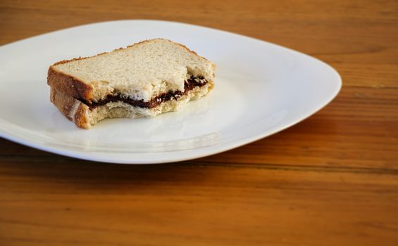 stuffed sandwich with chocolate cream on a white plate