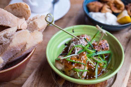 Close up view of teriyaki chicken tapas