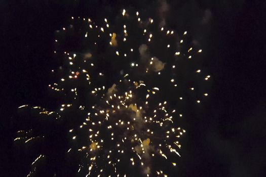 Festive salute in the night sky. Explosions of fireworks.