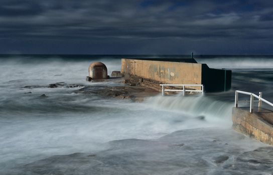 Large ocean swell on the coast fprced pceam baths and beaches to be closed. This pool completely underwater.  Location - Newcastle Ocean Baths
