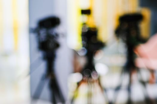 Abstract blurred background of video camera shooting  in studio, recording movie production