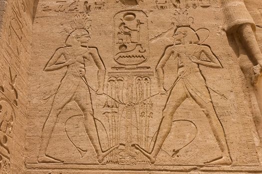 Egyptian hieroglyphs and drawings on the walls and columns. Egyptian language, The life of ancient gods and people in hieroglyphics and drawings