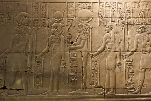 Egyptian hieroglyphs and drawings on the walls and columns. Egyptian language, The life of ancient gods and people in hieroglyphics and drawings