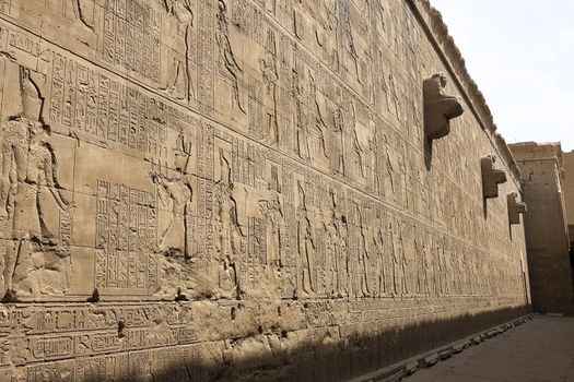 Egyptian hieroglyphs and drawings on the walls and columns. Egyptian language, The life of ancient gods and people in hieroglyphics and drawings