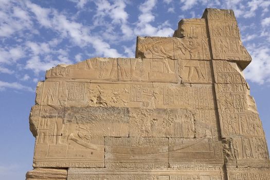 Egyptian hieroglyphs and drawings on the walls and columns. Egyptian language, The life of ancient gods and people in hieroglyphics and drawings