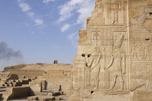 Egyptian hieroglyphs and drawings on the walls and columns. Egyptian language, The life of ancient gods and people in hieroglyphics and drawings