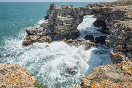 Waves pounding a beautiful rock shore of sea or ocean, Tyulenovo, Bulgaria.