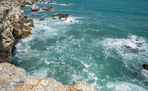 Waves pounding a beautiful rock shore of sea or ocean, Tyulenovo, Bulgaria.