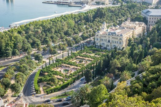 Aerial view of City Hall and gardens in Malaga, Andalusia, Spain at sunset