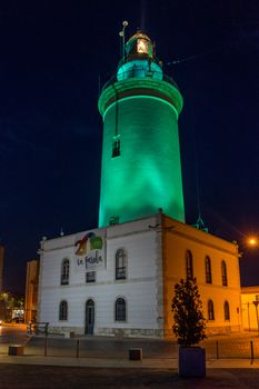 View of the white lighthouse of Malaga, Spain, Europe at night