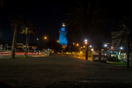 View of the white lighthouse of Malaga, Spain, Europe at night