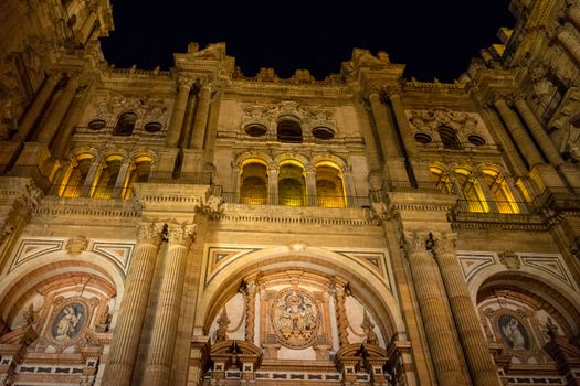 Baroque design of the main doors to the Malaga Cathedral in Malaga, Andalusia, Spain, Europe on a summer night