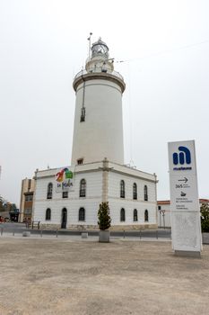 The lighthouse at Malagueta beach in Malaga, Spain, Europe on a cloudy morning