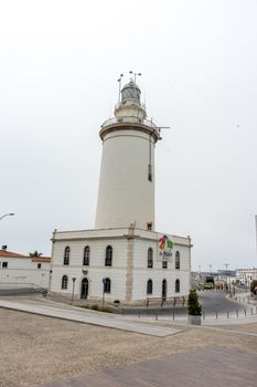 The lighthouse at Malagueta beach in Malaga, Spain, Europe on a cloudy morning