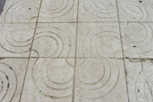 Stone design pattern along the Malagueta beach in Malaga, Spain, Europe on a foggy morning