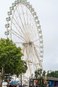 The giant wheel in the city of Malaga, Spain, Europe on a summer morning, Malaga eye