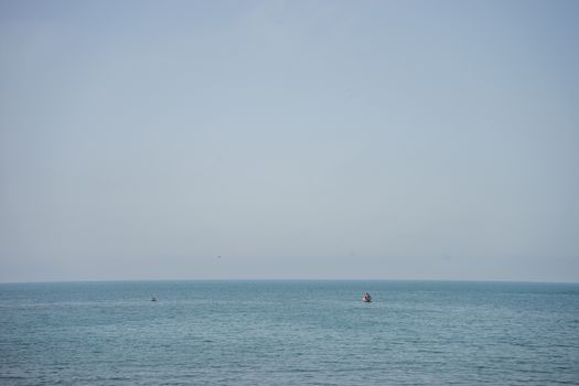 Calm and serene ocean  with a lonely boat at Malaga, Spain, Europe with clear sky and morning vibe