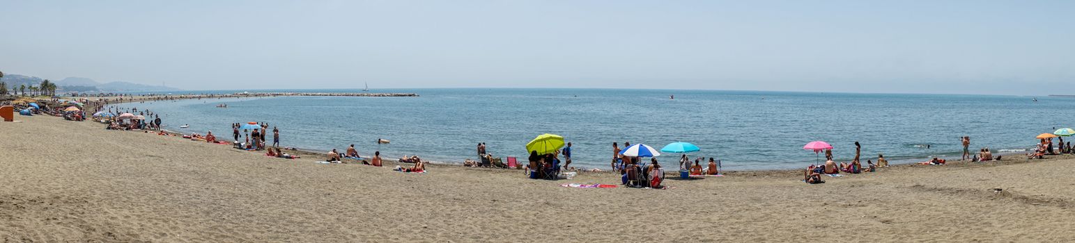 Panoramic view of the ocean at Malagueta beach with sand at Malaga, Spain, Europe on a clear sky morning